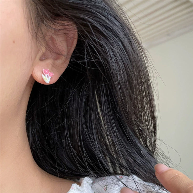 Örhängen med torkad blomma