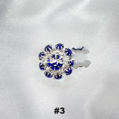 Blommiga diamantknappar på ärmarna