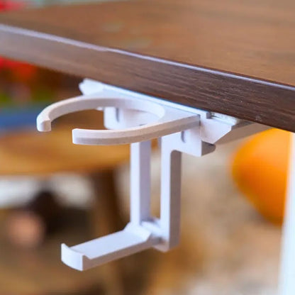 Vikbar mugghållare för skrivbordet