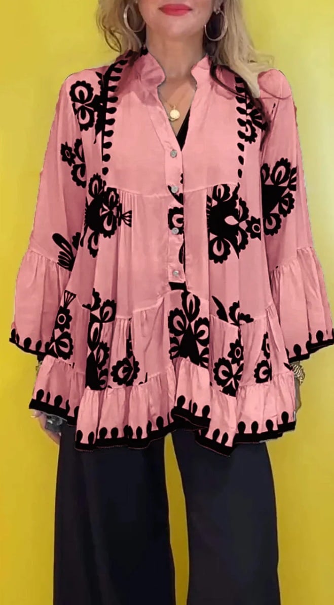 Topp i Boho-style med lösa volanger och knappar framtill