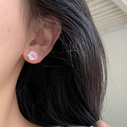 Örhängen med torkad blomma