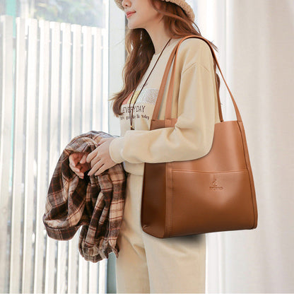 Högkvalitativ axelremsväska i en enfärgad färg