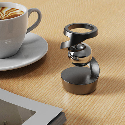 Kinetisk skrivbordsleksak som trotsar gravitationen