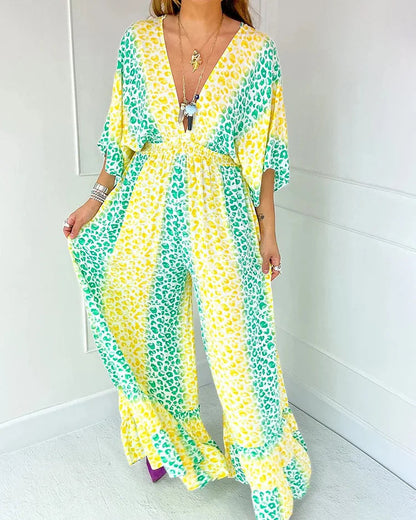 Sommarmönstrad V-ringad jumpsuit med vida ben